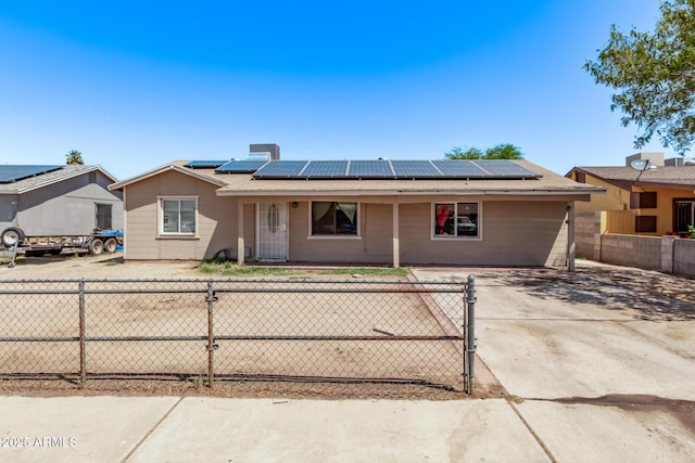 ranch-style house with solar panels