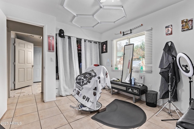 exercise area featuring light tile patterned floors