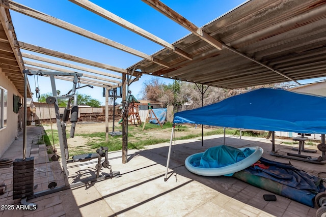 view of patio / terrace featuring a fenced backyard and a pergola