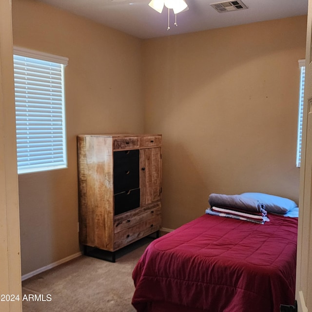 bedroom featuring ceiling fan and carpet floors