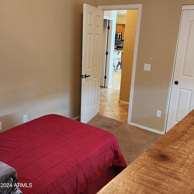 bedroom with light colored carpet