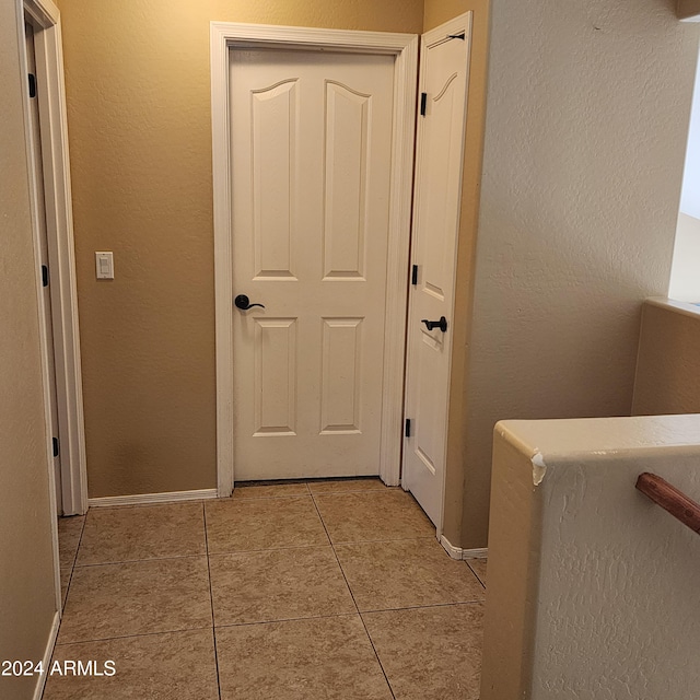 hallway with light tile patterned flooring