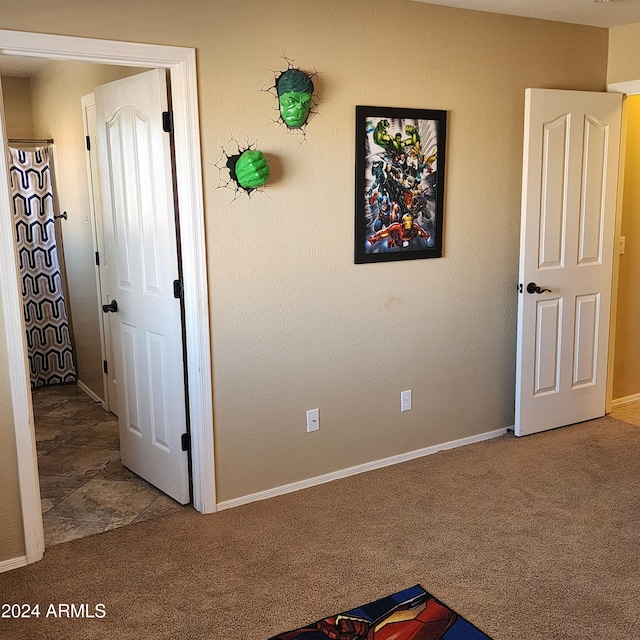 unfurnished bedroom featuring carpet floors