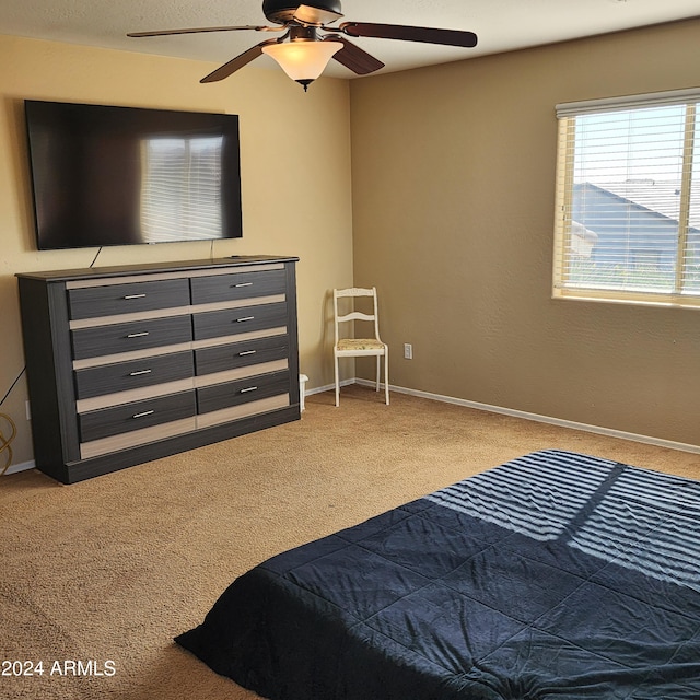 bedroom with ceiling fan and carpet