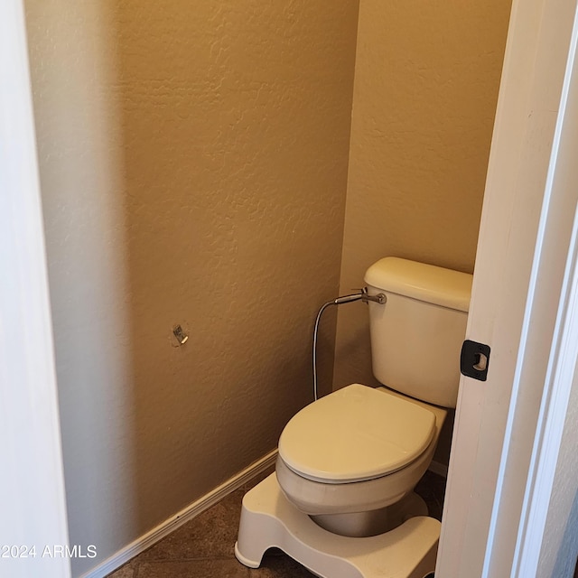 bathroom featuring tile patterned floors and toilet