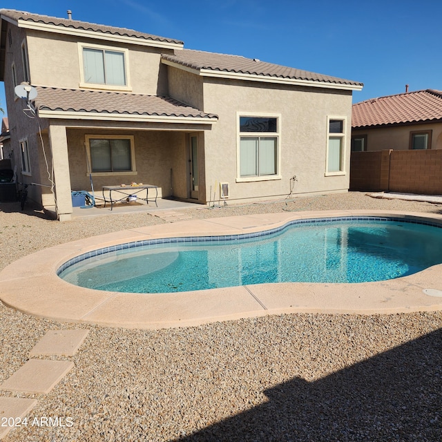 back of property featuring a patio area