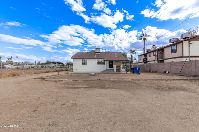 back of house with a patio area, central AC unit, and fence