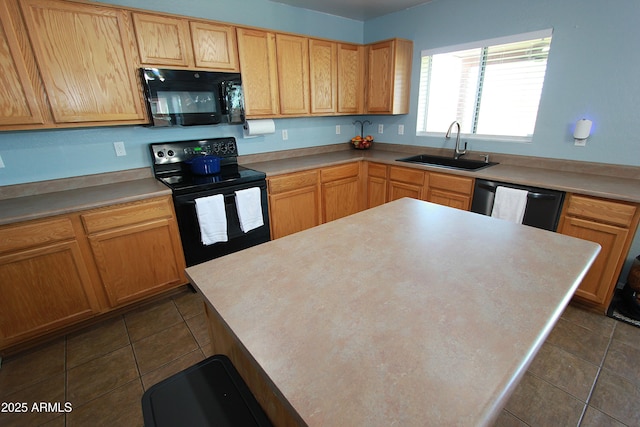 2434 E San Manuel Rd, San Tan Valley, AZ 85143 - kitchen with a sink, a center island, dark tile patterned flooring, and black appliances