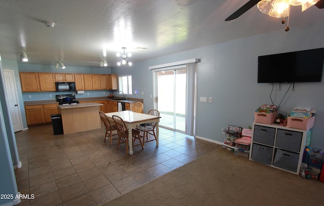 2434 E San Manuel Rd, San Tan Valley, AZ 85143 - dining space with tile patterned floors, baseboards, and a ceiling fan