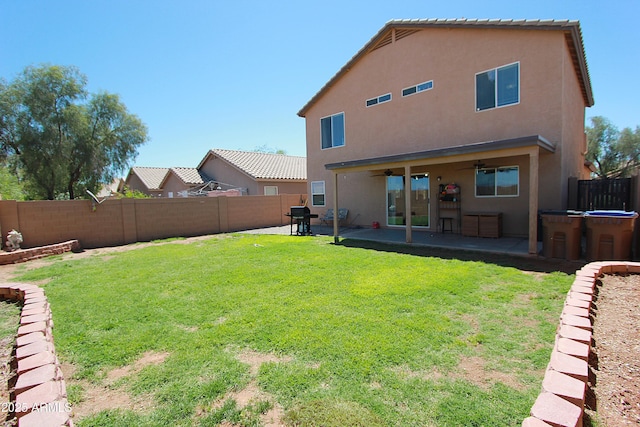 2434 E San Manuel Rd, San Tan Valley, AZ 85143 - back of house featuring a fenced backyard, ceiling fan, a patio area, and stucco siding