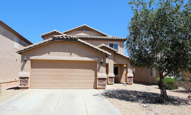 2434 E San Manuel Rd, San Tan Valley, AZ 85143 - view of front of house featuring concrete driveway, stucco siding, a tile roof, and a garage
