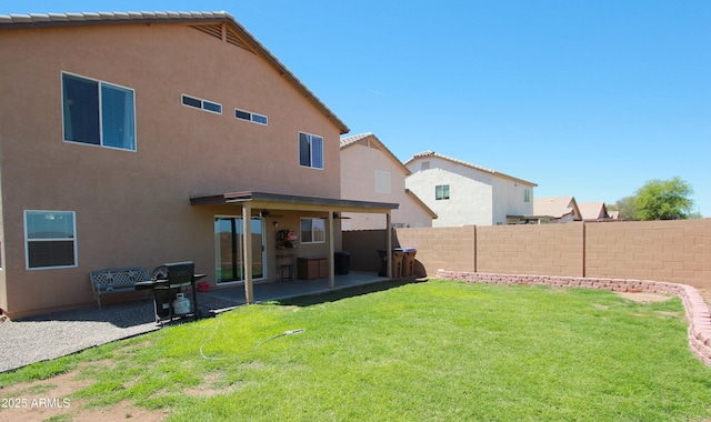 2434 E San Manuel Rd, San Tan Valley, AZ 85143 - rear view of property featuring a fenced backyard, a patio area, stucco siding, and a yard