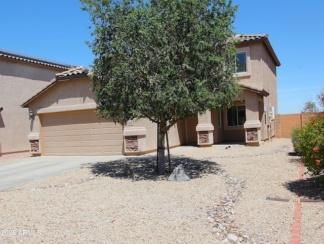 2434 E San Manuel Rd, San Tan Valley, AZ 85143 - view of front of home with an attached garage, a tiled roof, stucco siding, and driveway