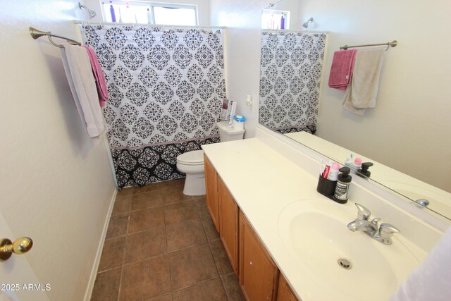 2434 E San Manuel Rd, San Tan Valley, AZ 85143 - full bath with toilet, vanity, tile patterned flooring, a shower with shower curtain, and baseboards
