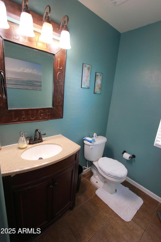 2434 E San Manuel Rd, San Tan Valley, AZ 85143 - bathroom featuring vanity, toilet, baseboards, and tile patterned floors
