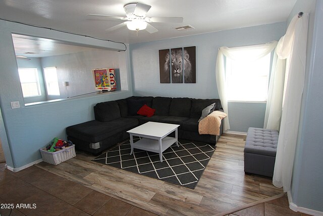 2434 E San Manuel Rd, San Tan Valley, AZ 85143 - living room featuring baseboards, a ceiling fan, visible vents, and wood finished floors