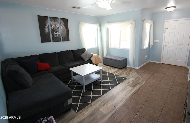 2434 E San Manuel Rd, San Tan Valley, AZ 85143 - living room with baseboards, ceiling fan, visible vents, and wood finished floors