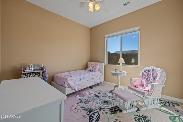 bedroom with a ceiling fan, baseboards, visible vents, and carpet
