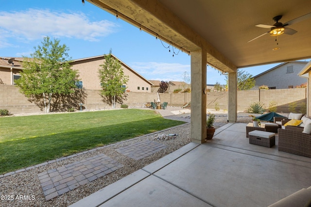 view of patio / terrace featuring a fenced backyard and a ceiling fan