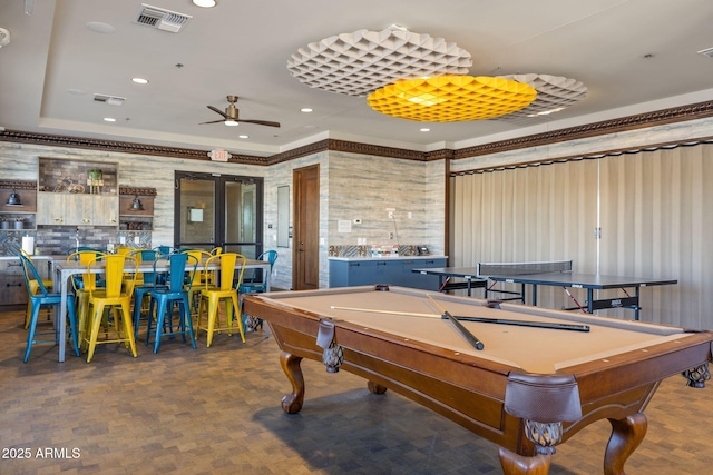 rec room with ceiling fan, visible vents, billiards, and a tray ceiling