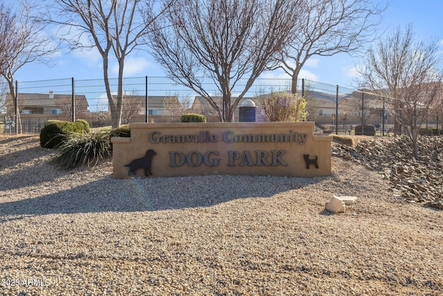 community sign featuring fence