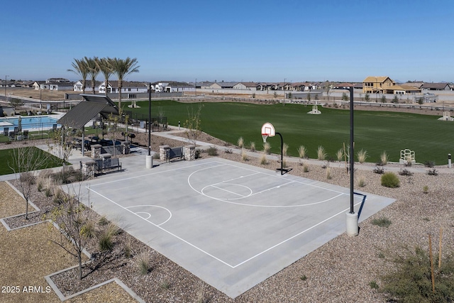 view of basketball court featuring community basketball court and a residential view
