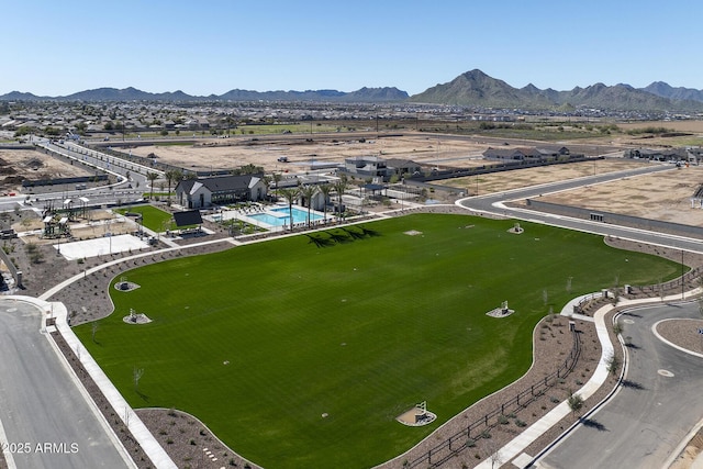bird's eye view of mountains and a pool area
