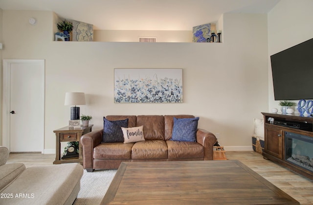 12041 S 45th St, Phoenix, AZ 85044 - living area featuring light wood-style floors, baseboards, and visible vents