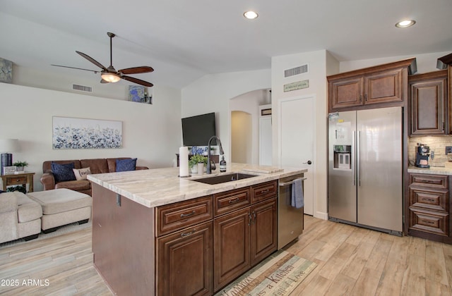 12041 S 45th St, Phoenix, AZ 85044 - kitchen featuring ceiling fan, arched walkways, visible vents, a sink, and stainless steel appliances