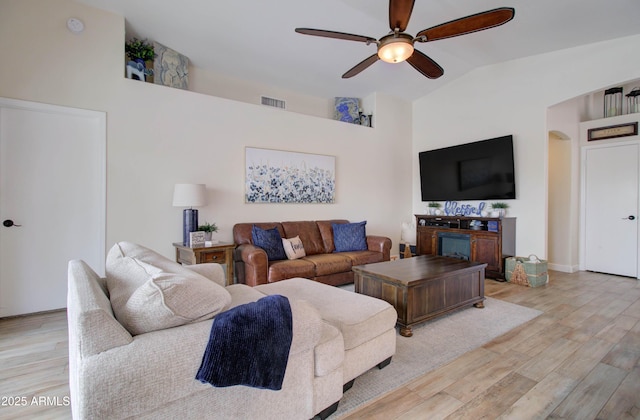12041 S 45th St, Phoenix, AZ 85044 - living area featuring visible vents, arched walkways, ceiling fan, light wood finished floors, and lofted ceiling