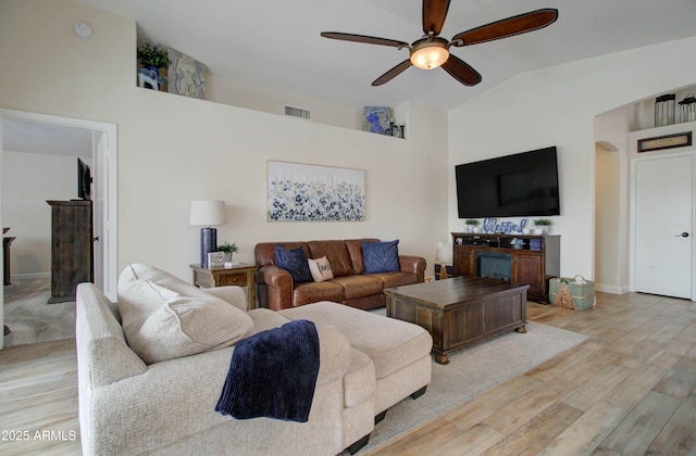12041 S 45th St, Phoenix, AZ 85044 - living area with visible vents, arched walkways, a ceiling fan, light wood-style floors, and vaulted ceiling