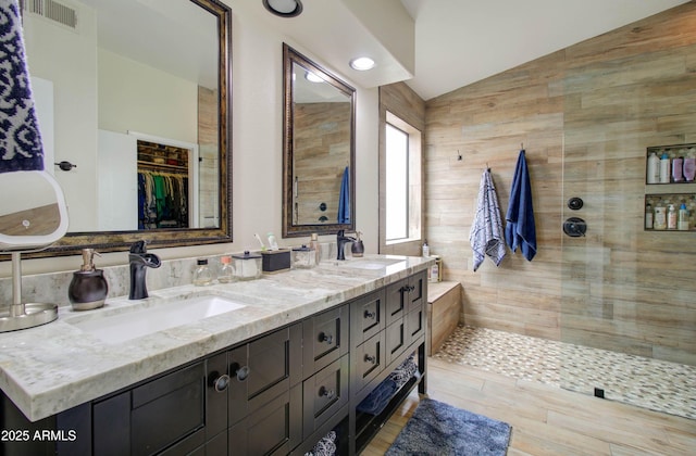 12041 S 45th St, Phoenix, AZ 85044 - bathroom featuring a sink, visible vents, a walk in shower, and vaulted ceiling