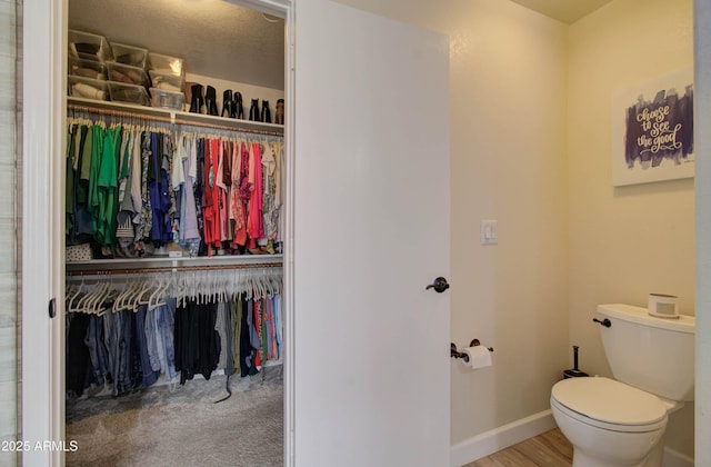 12041 S 45th St, Phoenix, AZ 85044 - bathroom featuring toilet, a walk in closet, and baseboards