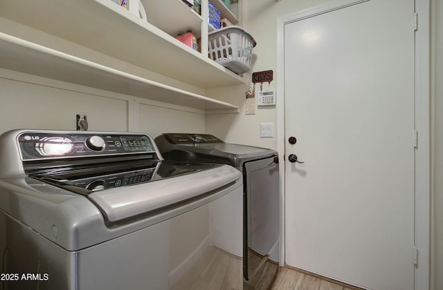12041 S 45th St, Phoenix, AZ 85044 - laundry area with laundry area, washing machine and dryer, and light wood-style floors