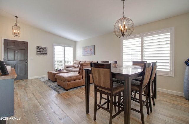 12041 S 45th St, Phoenix, AZ 85044 - dining room featuring light wood finished floors, a notable chandelier, and vaulted ceiling
