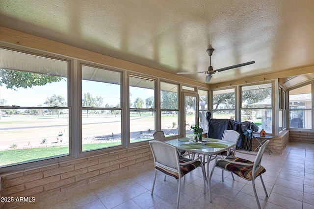 sunroom / solarium featuring ceiling fan