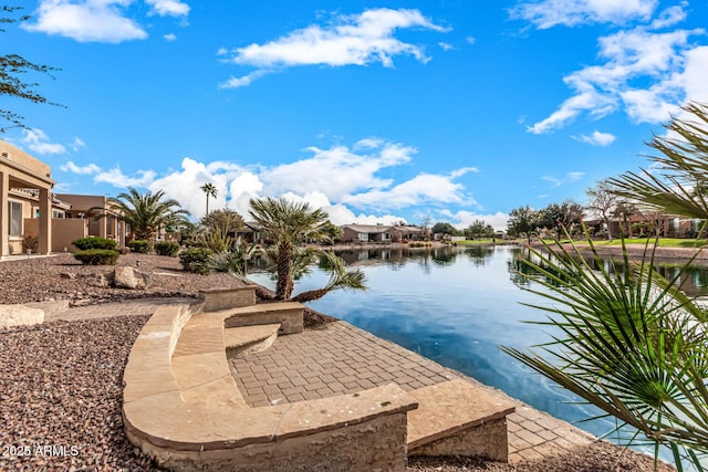 exterior space with a patio area and a water view