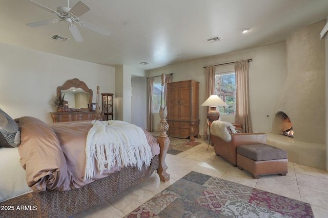 tiled bedroom with ceiling fan