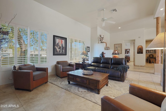 tiled living room featuring ceiling fan