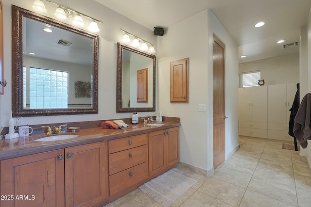 bathroom with vanity and tile patterned flooring