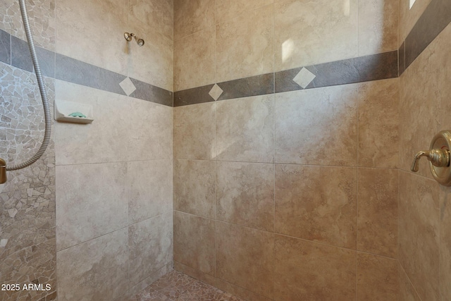 details featuring a tile shower