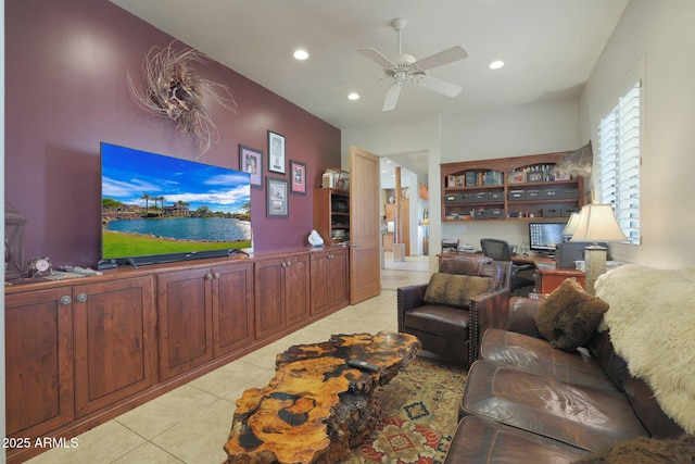 living room featuring ceiling fan and light tile patterned floors