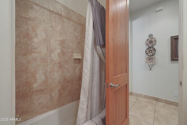 bathroom with shower / bath combo and tile patterned flooring