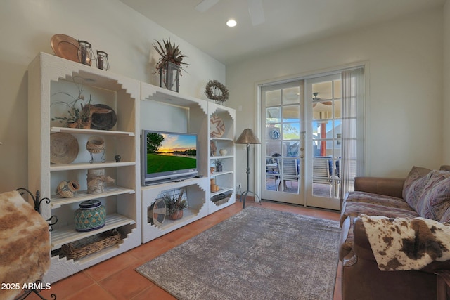 tiled living room featuring ceiling fan and french doors