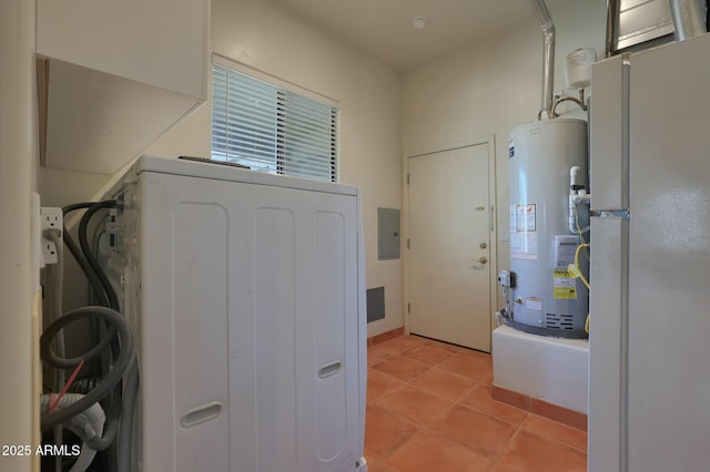 laundry room featuring light tile patterned floors, washer / dryer, electric panel, and gas water heater