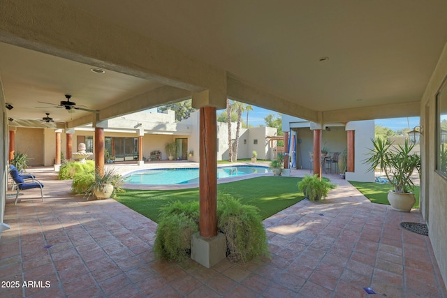 view of patio featuring ceiling fan