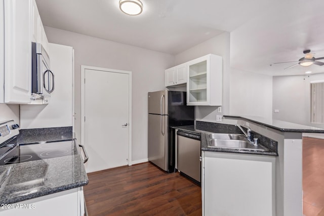 kitchen featuring dark wood-type flooring, white cabinets, sink, kitchen peninsula, and stainless steel appliances