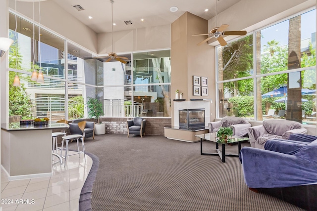 sunroom featuring a wealth of natural light and ceiling fan