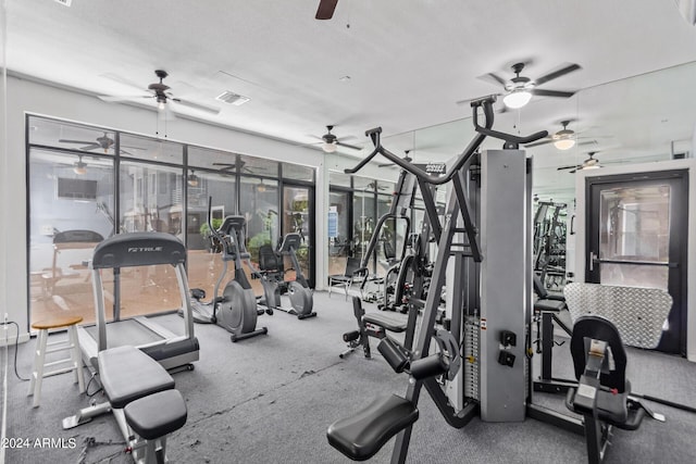 workout area featuring a textured ceiling