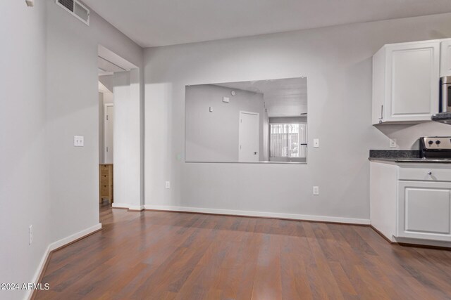 dining space with dark hardwood / wood-style flooring